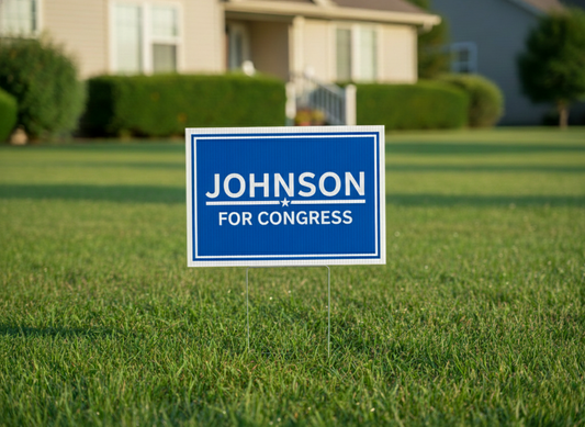 An example of a campaign yard sign featuring a high-contrast blue background with white sans-serif typography. The name "JOHNSON" is the primary focal point, emphasizing brand recognition in political design.