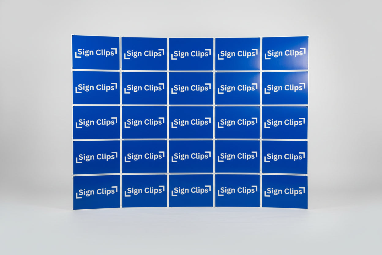 A professional display wall created by connecting multiple yard signs with Sign Clip hardware, showing a modular and sturdy backdrop setup.